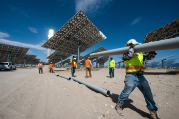 Contractors building a concentrating solar-thermal power plant.