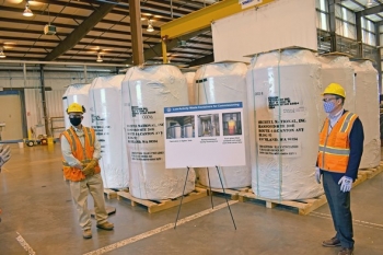 EM Senior Advisor William âIkeâ White, right, stopped by the Waste Treatment and Immobilization Plant during a visit to the Hanford Site last week and saw the first 20 containers that will hold waste simulant and tank waste that is vitrified.