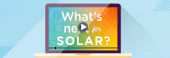 A laptop with a screen that says "What's Next for Solar?" with a play button