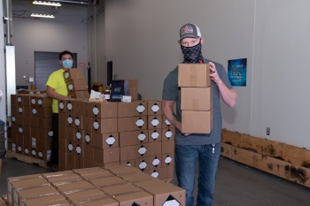 KCNSC volunteers get ready to ship appreciation boxes to KCNSC employees to thank them for their hard work during this trying year.