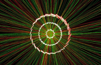A collision recorded by the Relativistic Heavy Ion Collider. The white points show âhitsâ from particles emerging from the collision. Scientists use the hits to reconstruct charged particle tracks (red and green lines) and measure particlesâ abundance. A collision recorded by the Relativistic Heavy Ion Collider. The white points show âhitsâ from particles emerging from the collision. Scientists use the hits to reconstruct charged particle tracks (red and green lines) and measure particlesâ abundance.