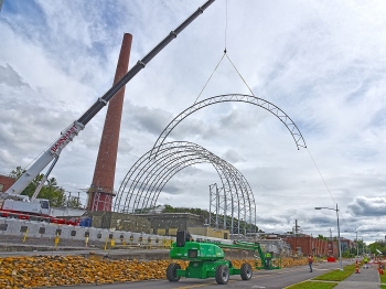 Crews install the framework for a protective cover over the hot cells at Building 3026 at Oak Ridge National Laboratory.