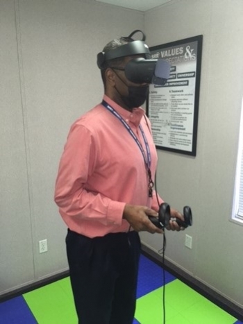 Defense Waste Processing Facility Crane Manager Robbie Robinson uses 3D virtual reality equipment to view images from inside the Salt Waste Processing Facility.