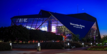 Photo of Mercedes-Benz Stadium at night in Atlanta.