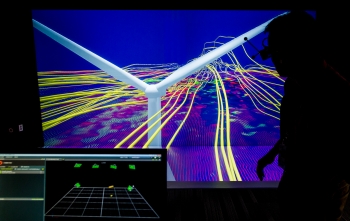 National Renewable Energy Laboratory Senior Scientist Kenny Gruchalla examines the velocity field from from a wind turbine simulation using a 3D model at the Energy Systems Integration Facility.