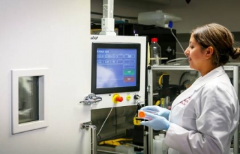 A cancer researcher prepares to irradiate a cell sample using an X-ray irradiator (pictured). This particular irradiator was provided under a partnership with NNSA under the Cesium Irradiator Replacement Project.