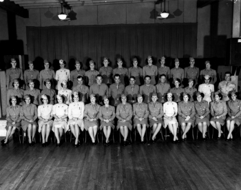 A Group of Army Corps Members & Nurses Pose for a Photograph