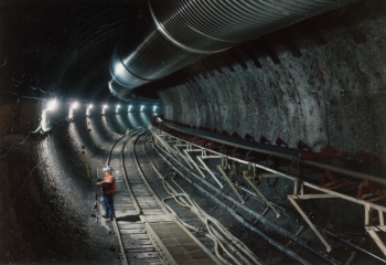View of the first curve in the main drift of the Exploratory Studies Facility in October 1995