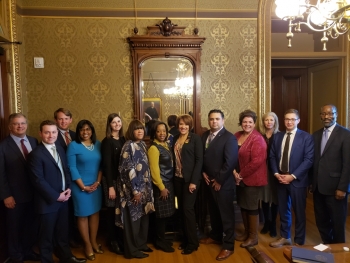 Officials from the city of Flint, Michigan, the DOE and the White House after a meeting to discuss the New Opportunity and Revitalization Council. Officials from the city of Flint, Michigan, the DOE and the White House in a group photo after the meeting.