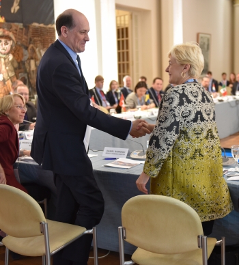 Acting Assistant Secretary of State for Arms Control, Verification and Compliance, Anita Friedt, shakes hands with Deputy Foreig