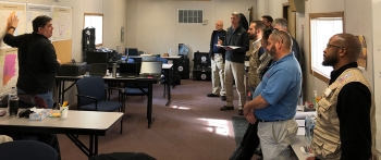 Bill Beal from the Remote Sensing Lab briefing the DART team.