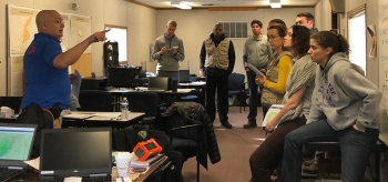 DART Field Monitoring Specialist, John Aloi/BNL, (second from left) briefs the DART on radiation dosimetry.