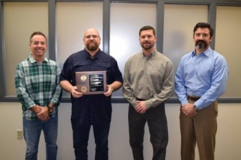 OST Vulnerability Analysis Team, left to right, Chad Ouellette and Jeff Beck of OST; and Derek Farr and Charles Hedrick of Sandia National Laboratories. Not pictured: Scott Rogers and Carlos Montanez of OST.