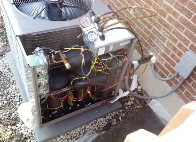 Photo of the prototype cold climate heat pump outdoor unit, installed at the Ohio field test site in January 2015. <br />Credit: Oak Ridge National Laboratory Photo of the prototype cold climate heat pump outdoor unit, installed at the Ohio field test site in January 2015. <br />Credit: Oak Ridge National Laboratory