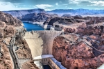 Water and Hoover dam against the mountains.