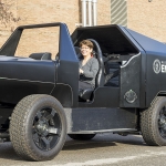 Woman sitting in a U.S. Department of Energy vehicle.