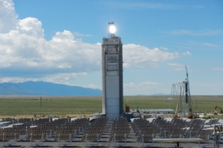 Sunlight reflected from heliostats is shining directly on the particle receiver, which is currently being tested on top of the solar tower at the National Solar Thermal Test Facility. Sunlight reflected from heliostats is shining directly on the particle receiver, which is currently being tested on top of the s