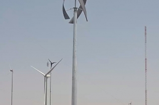 Urban Green Energy’s Vision Air 5, 3.2-kW wind turbine at the National Wind Technology Center at NREL. <em>Photo by Lee Fingersh, NREL</em> A photo of a horizontal wind turbine in a field with other wind turbines in the background.